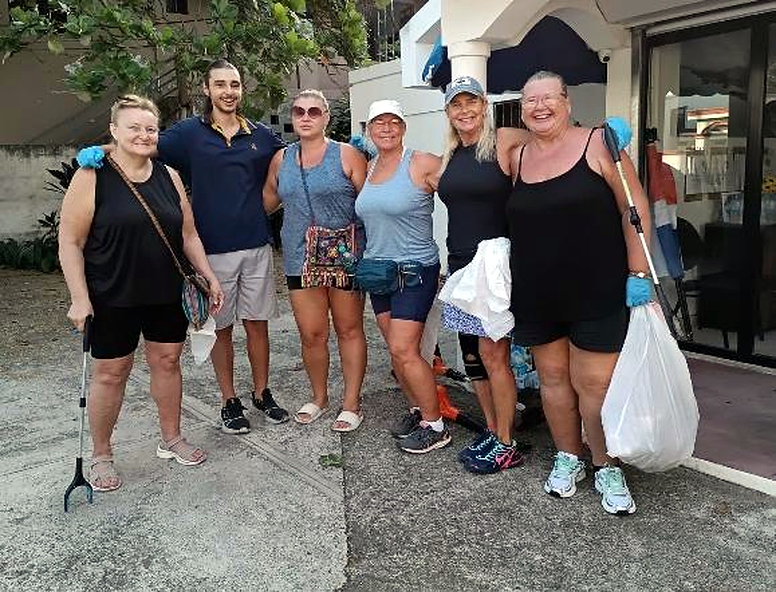 September cleanup volunteers with trash bags and pickers